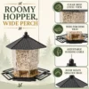 Hanging hopper bird feeder with sheltered seed reservoir, wide tray, and easy refill roof