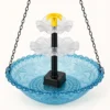 Close view of a blue hanging bird bath with pump and two clear cascade tiers